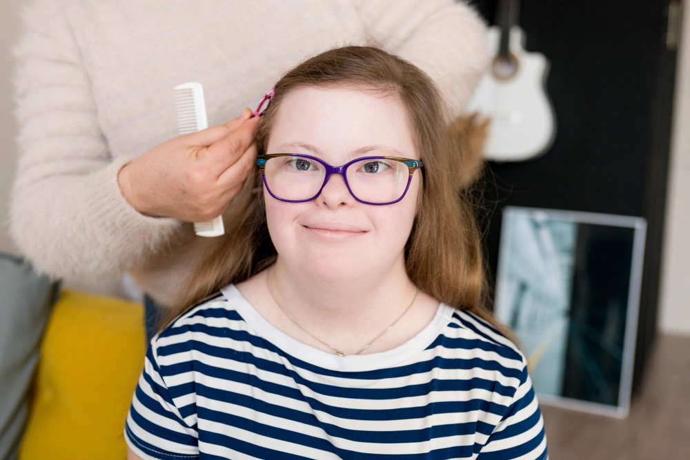 Disabled girl getting her hair done